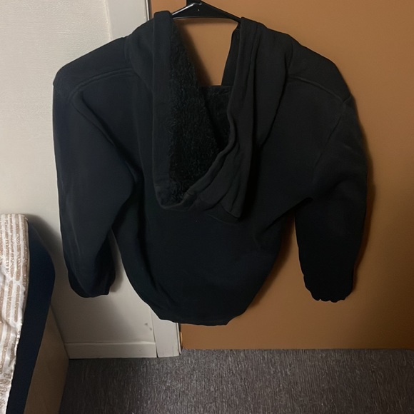 This is a zip up sweater with fuzzy cotton inside. - Picture 2 of 3